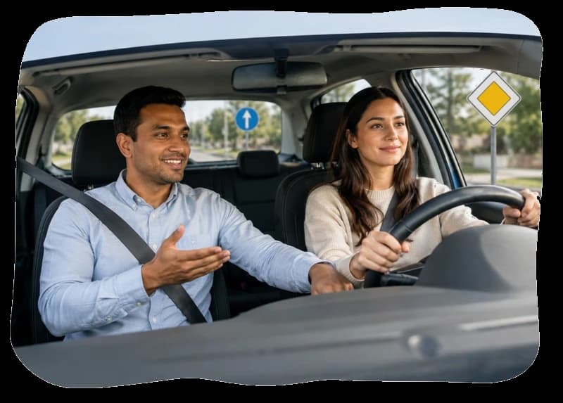 Certified driving instructor teaching a student during an in-car driving lesson in Irving, Texas